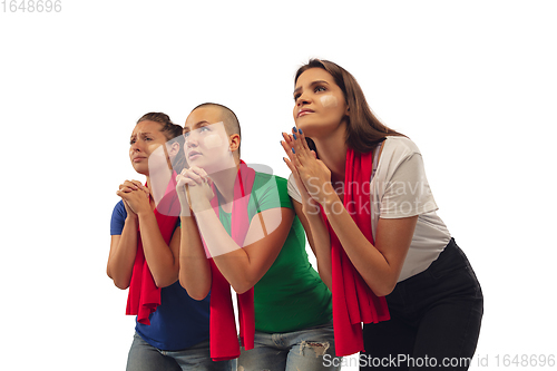 Image of Female soccer fans cheering for favourite sport team with bright emotions isolated on white studio background