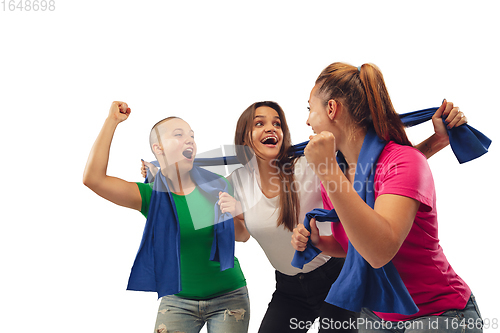 Image of Female soccer fans cheering for favourite sport team with bright emotions isolated on white studio background