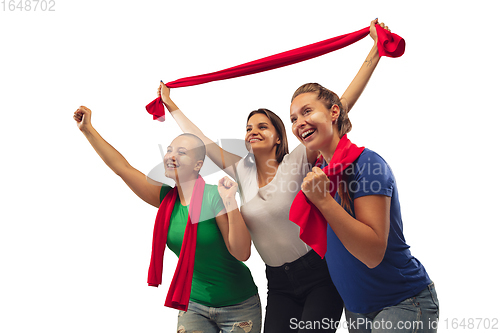 Image of Female soccer fans cheering for favourite sport team with bright emotions isolated on white studio background