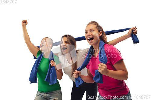 Image of Female soccer fans cheering for favourite sport team with bright emotions isolated on white studio background