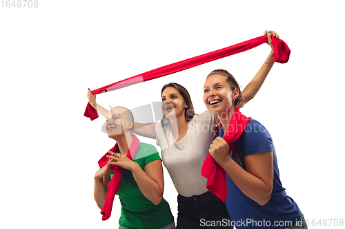 Image of Female soccer fans cheering for favourite sport team with bright emotions isolated on white studio background