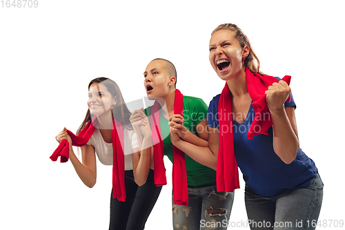 Image of Female soccer fans cheering for favourite sport team with bright emotions isolated on white studio background