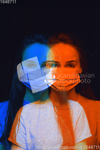 Image of Close up portrait of caucasian woman wearing face mask on studio background. Modern and trendy duotone effect, double exposure