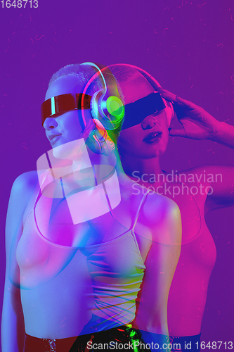 Image of Close up portrait of caucasian woman using devices, gadgets on studio background. Modern and trendy duotone effect, double exposure