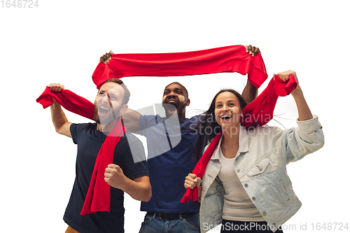 Image of Multiethnic soccer fans cheering for favourite sport team with bright emotions isolated on white studio background