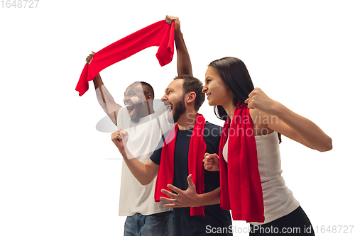 Image of Multiethnic soccer fans cheering for favourite sport team with bright emotions isolated on white studio background