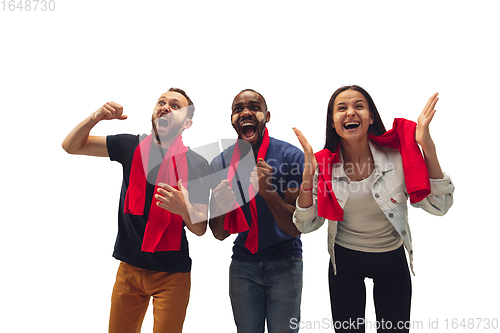 Image of Multiethnic soccer fans cheering for favourite sport team with bright emotions isolated on white studio background