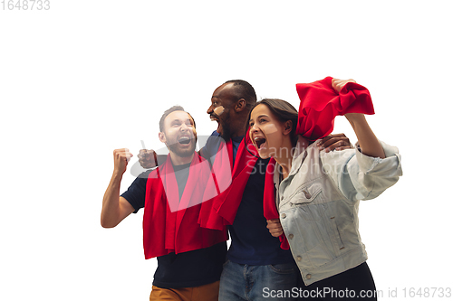 Image of Multiethnic soccer fans cheering for favourite sport team with bright emotions isolated on white studio background