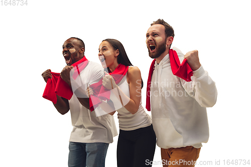 Image of Multiethnic soccer fans cheering for favourite sport team with bright emotions isolated on white studio background