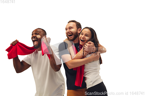 Image of Multiethnic soccer fans cheering for favourite sport team with bright emotions isolated on white studio background