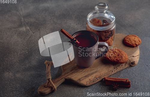 Image of Cup of tea or coffee with cinnamon and cookies isolated on grey and white background. Copy Space for ad, design.