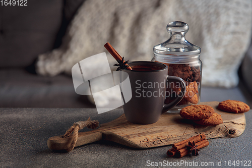 Image of Cup of tea or coffee with cinnamon and cookies isolated on grey and white background. Copy Space for ad, design.