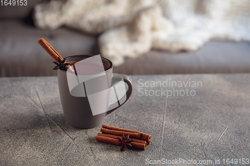 Image of Closeup cup of tea or coffee with cinnamon isolated on grey and white background. Copy Space for ad, design.