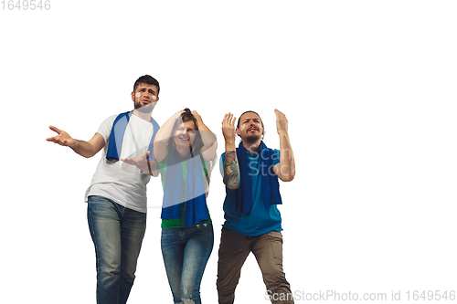 Image of Two men and woman as soccer fans cheering for favourite sport team with bright emotions isolated on white studio background