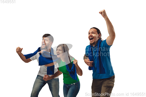 Image of Two men and woman as soccer fans cheering for favourite sport team with bright emotions isolated on white studio background