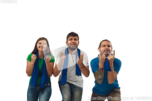 Image of Female and male soccer fans cheering for favourite sport team with bright emotions isolated on white studio background