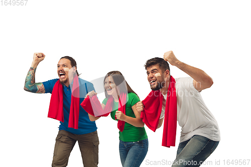 Image of Female and male soccer fans cheering for favourite sport team with bright emotions isolated on white studio background