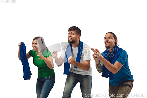 Image of Two men and woman as soccer fans cheering for favourite sport team with bright emotions isolated on white studio background