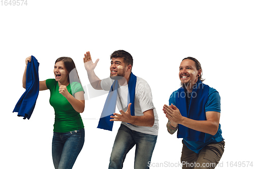 Image of Two men and woman as soccer fans cheering for favourite sport team with bright emotions isolated on white studio background