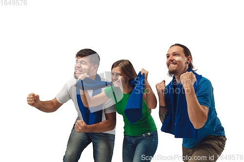 Image of Two men and woman as soccer fans cheering for favourite sport team with bright emotions isolated on white studio background