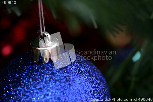 Image of Christmas ornaments on tree.