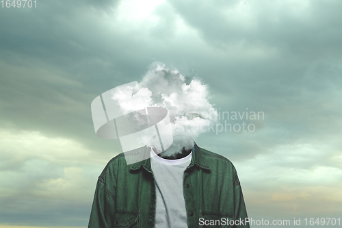 Image of Contemporary art collage. Male body of model with head full of smoke about sky and clouds.