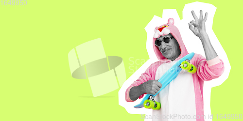 Image of Senior man in funny cute outfit isolated on light green background. Collage in magazine style.