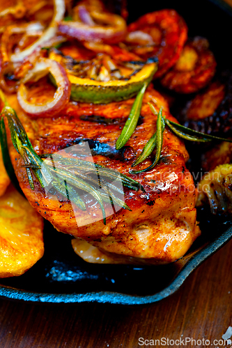 Image of roasted grilled BBQ chicken breast with herbs and spices