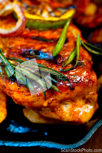 Image of roasted grilled BBQ chicken breast with herbs and spices