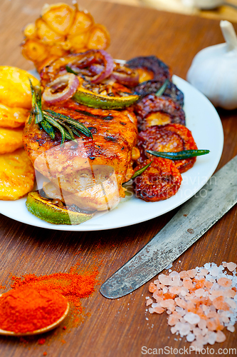 Image of roasted grilled BBQ chicken breast with herbs and spices