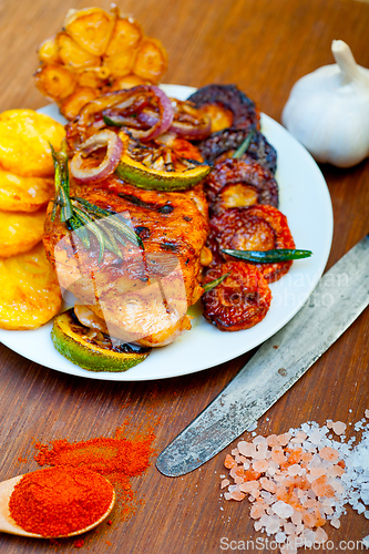 Image of roasted grilled BBQ chicken breast with herbs and spices