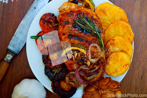 Image of roasted grilled BBQ chicken breast with herbs and spices