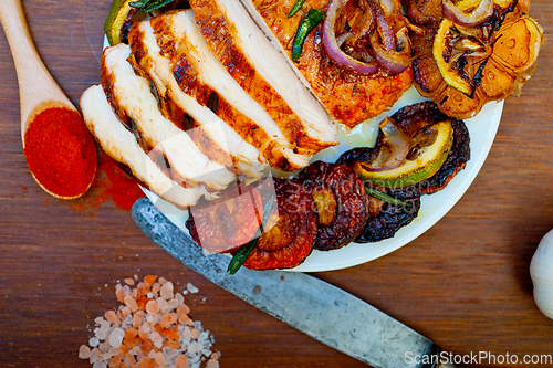 Image of roasted grilled BBQ chicken breast with herbs and spices