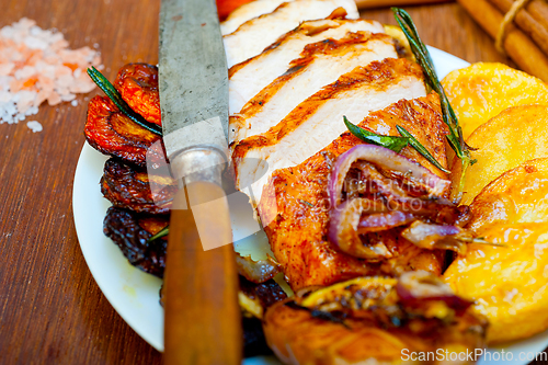 Image of roasted grilled BBQ chicken breast with herbs and spices