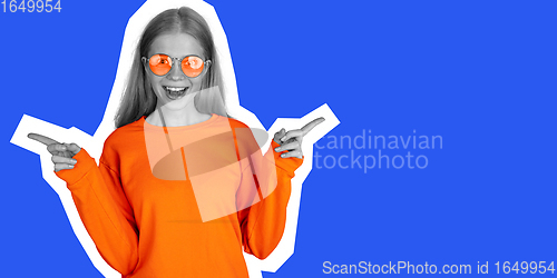 Image of Happy young beautiful girl posing isolated on blue background. Collage in magazine style. Flyer for ad.