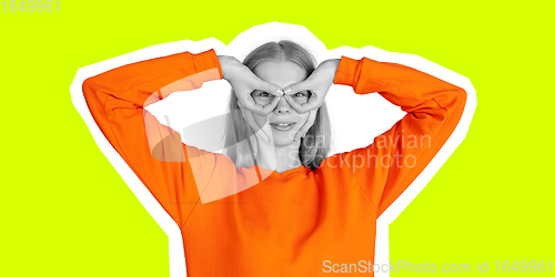 Image of Superhero posing young beautiful girl. Collage in magazine style with bright lemon color background.