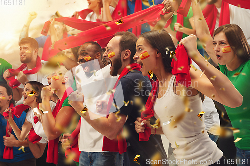 Image of Group of happy fans are cheering for their team victory. Collage made of 8 models.