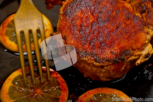 Image of pork chop seared on iron skillet