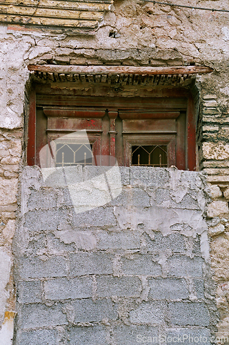 Image of bricked up vintage door and grungy wall