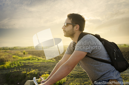 Image of Man with bicycle