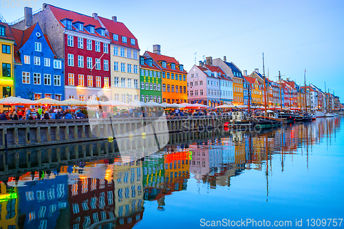 Image of illuminated Nyhavn embankment by canal 