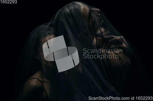 Image of Graceful classic ballet dancers isolated on black studio background. The grace, artist, movement, action and motion concept.