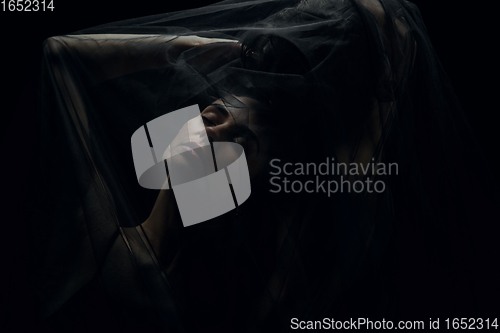 Image of Graceful classic ballet dancers isolated on black studio background. The grace, artist, movement, action and motion concept.