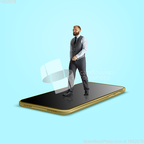 Image of Office worker, businessman going on the surface of smartphone\'s screen isolated on background