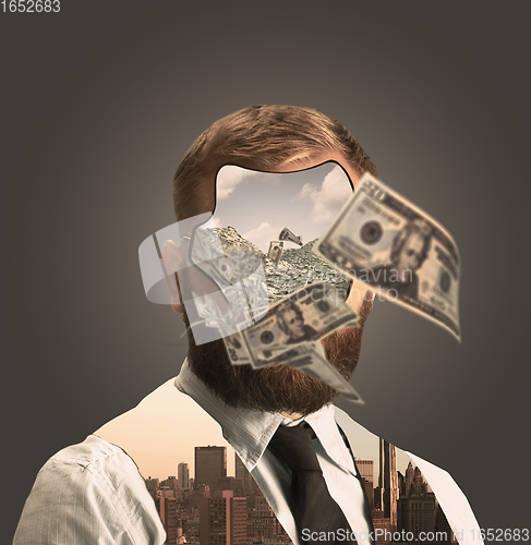 Image of Portrait of young businessman with bunch of money instead his face on grey background