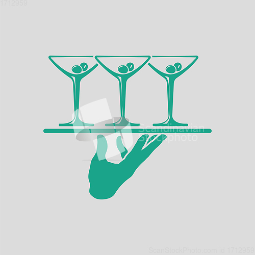 Image of Waiter hand holding tray with martini glasses icon