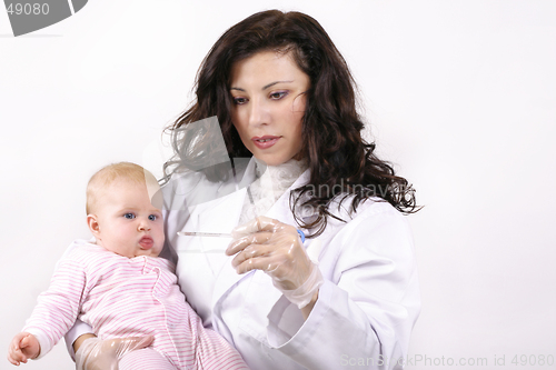 Image of Doctor with baby and thermometer