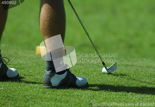 Image of player shooting golf ball