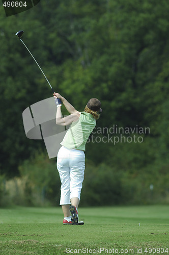 Image of Woman golfer doing a swing