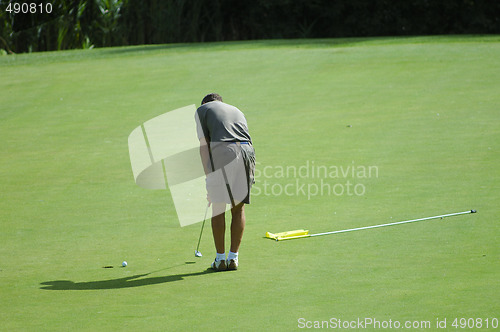 Image of golf player on the green